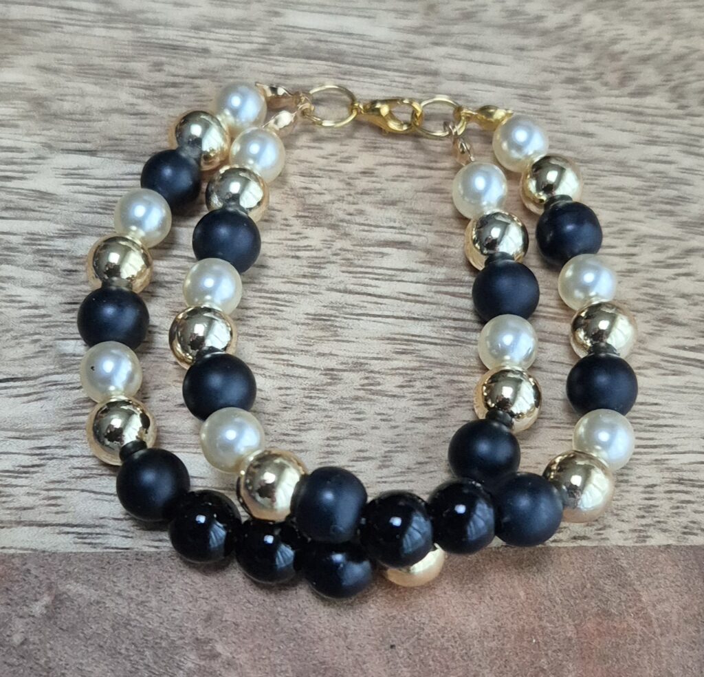 Goud/zwart armband