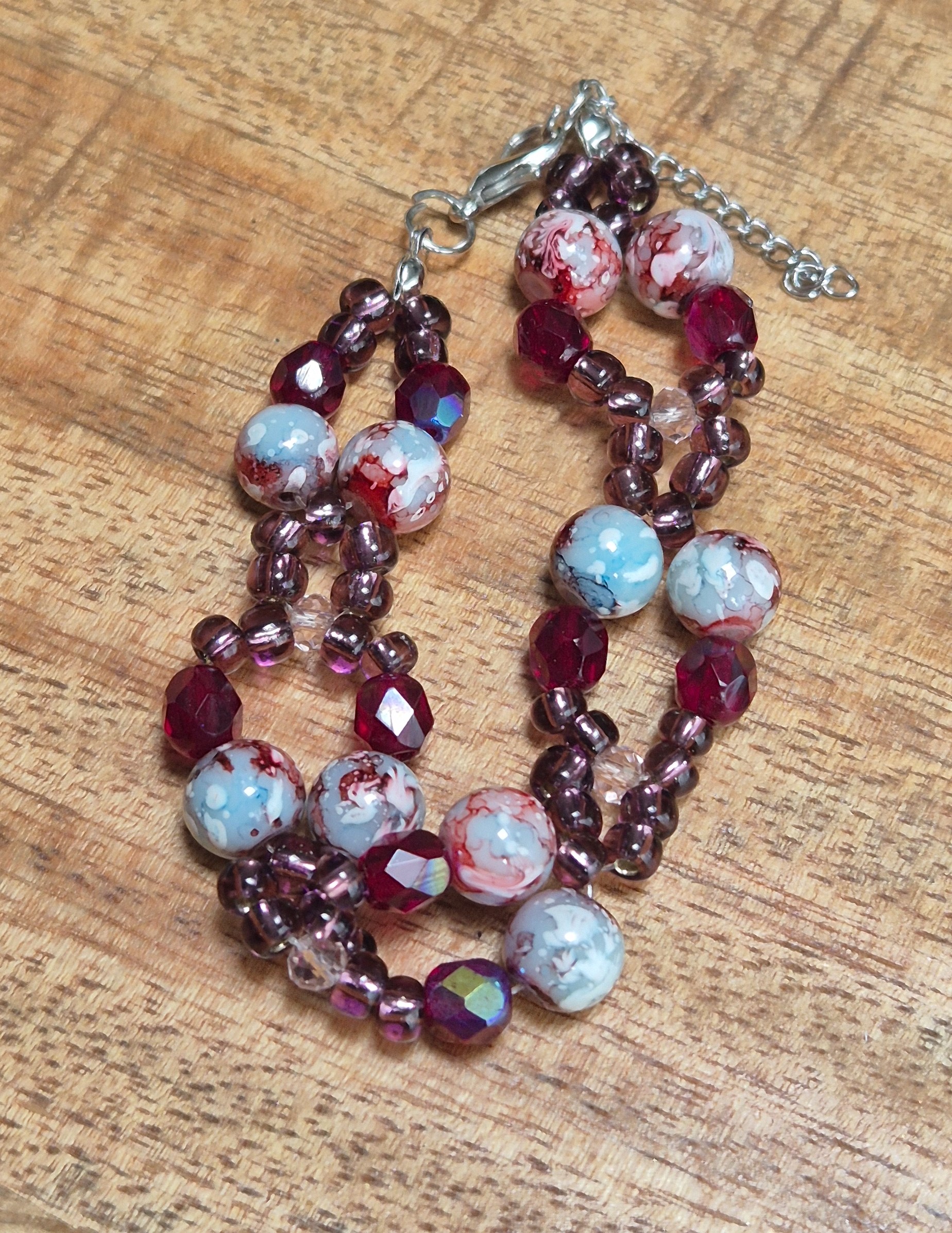 Paarse glaskralen armband