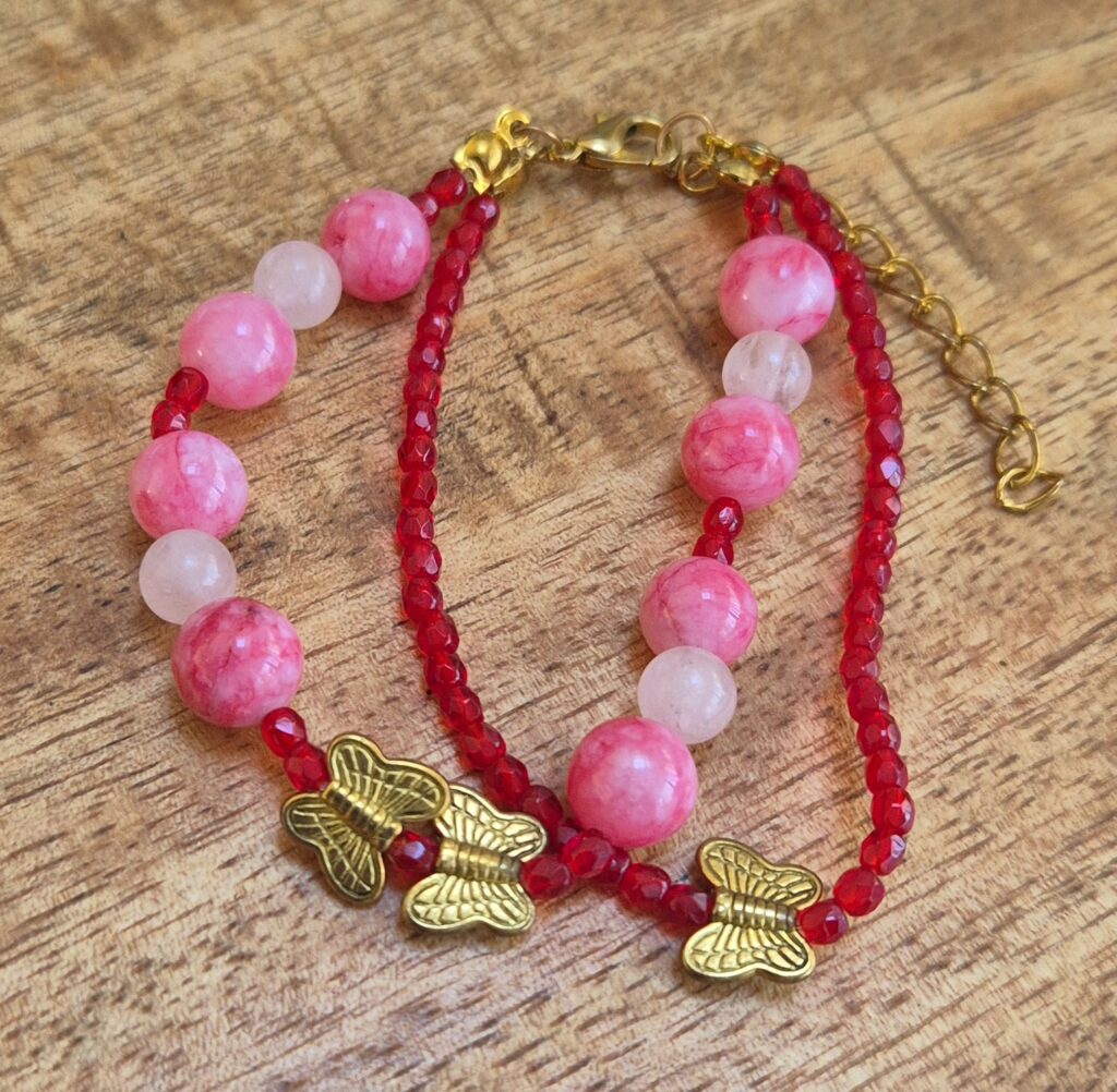 Vlinder armband rood/roze