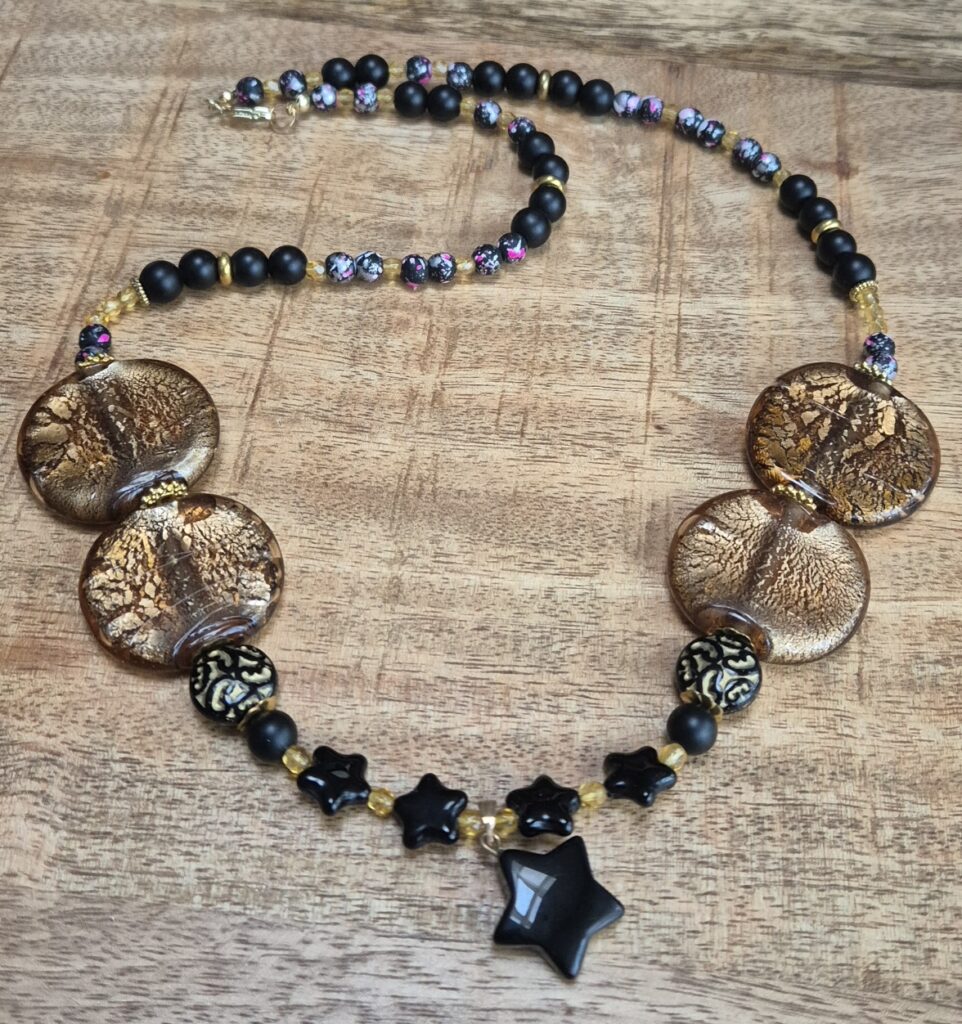Goudzwart ketting ster