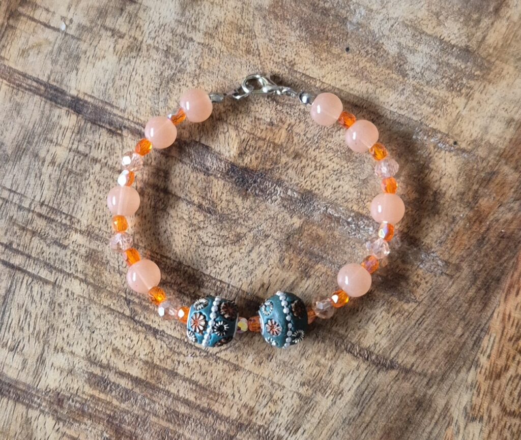 Oranje armband bloem